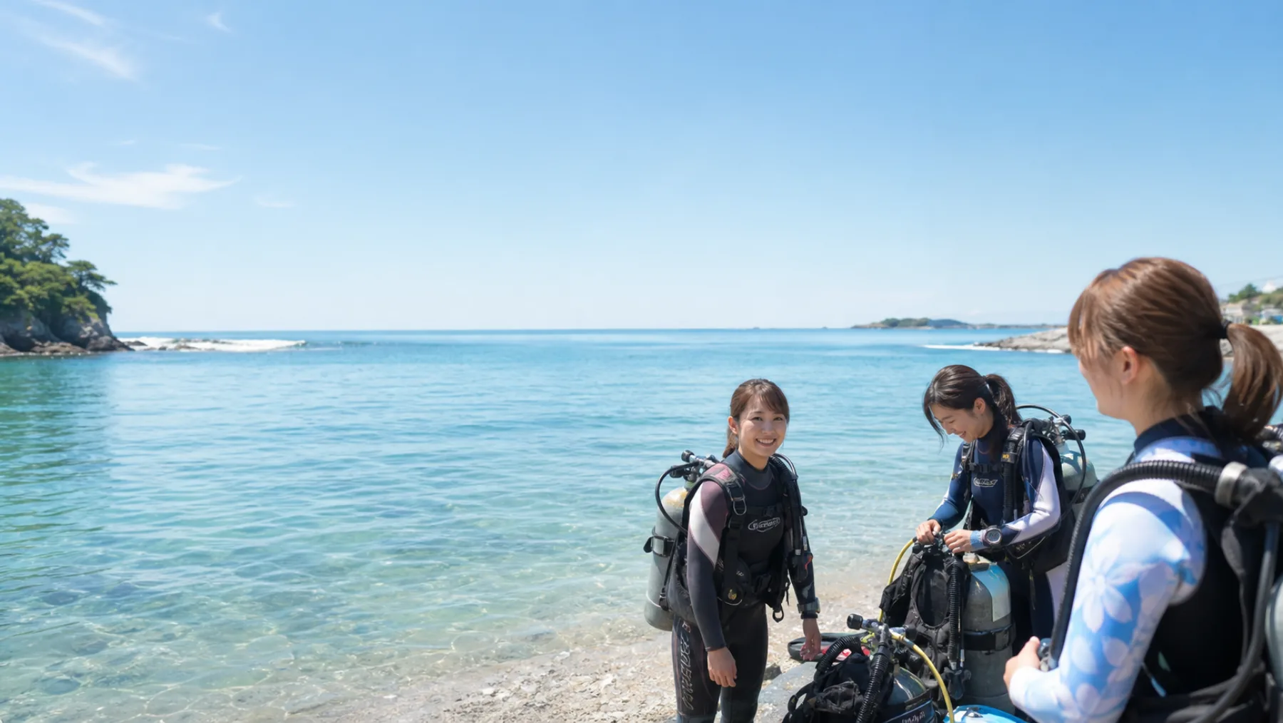 明るい三浦の海ではじめてのダイビングを楽しむ様子